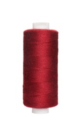 Spool of burgundy sewing thread isolated on white