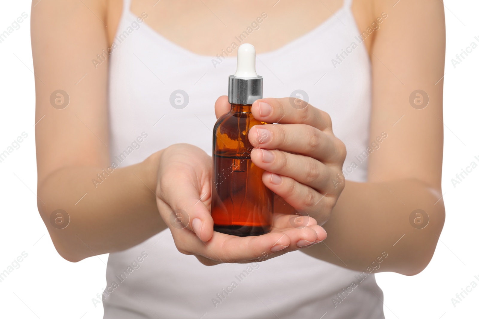 Photo of Young woman with bottle of essential oil on white background, closeup