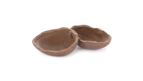 Photo of Broken milk chocolate egg on white background