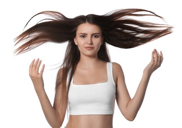 Young woman with strong healthy hair on white background