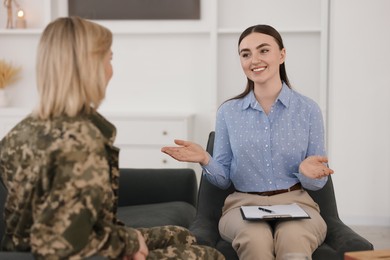 Psychotherapist working with military woman in office