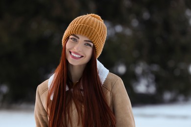Photo of Portrait of beautiful young woman on winter day outdoors