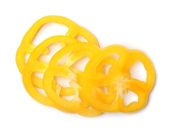 Slices of yellow bell pepper on white background, top view