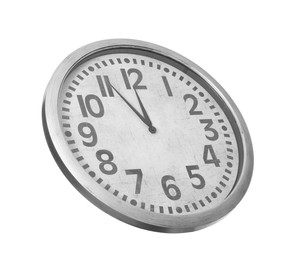 Clock showing five minutes until midnight on white background. New Year countdown