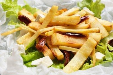 Delicious parsnip with lettuce, feta cheese and dates, closeup