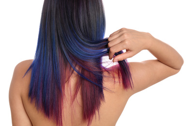 Young woman with bright dyed hair on white background, back view. Closeup