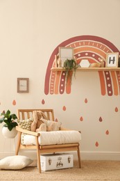 Photo of Child's room interior with rainbow painting on wall
