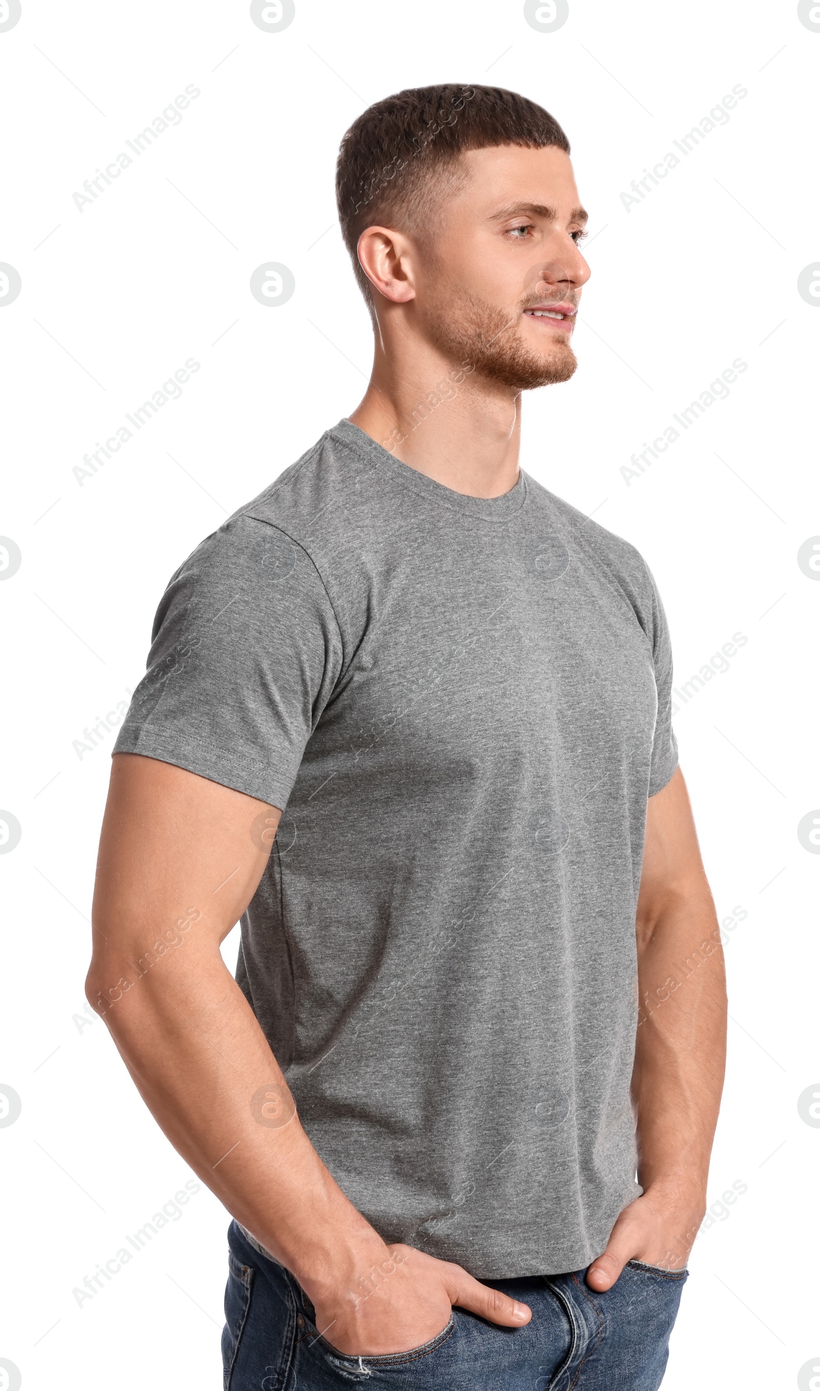 Photo of Man wearing grey t-shirt on white background. Mockup for design