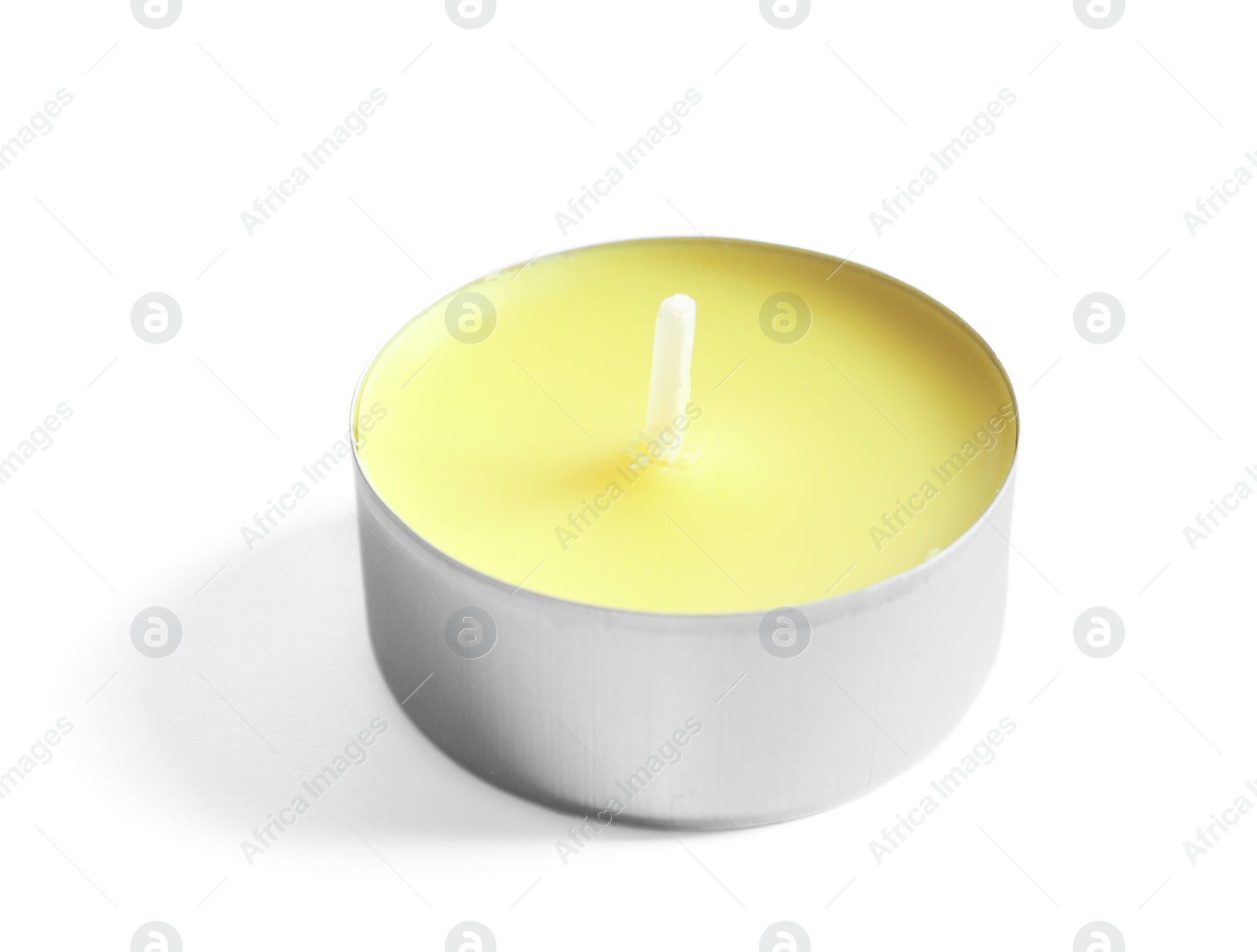 Photo of New small wax candle on white background