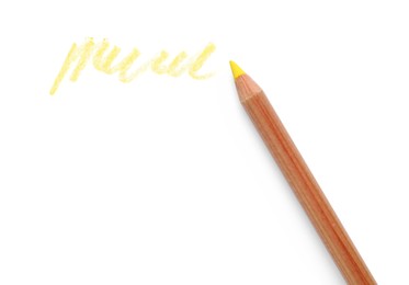 Yellow pastel pencil and scribble isolated on white, top view. Drawing supply