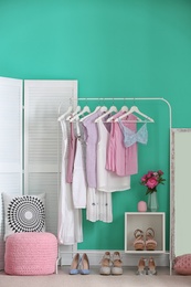 Stylish dressing room interior with clothes rack