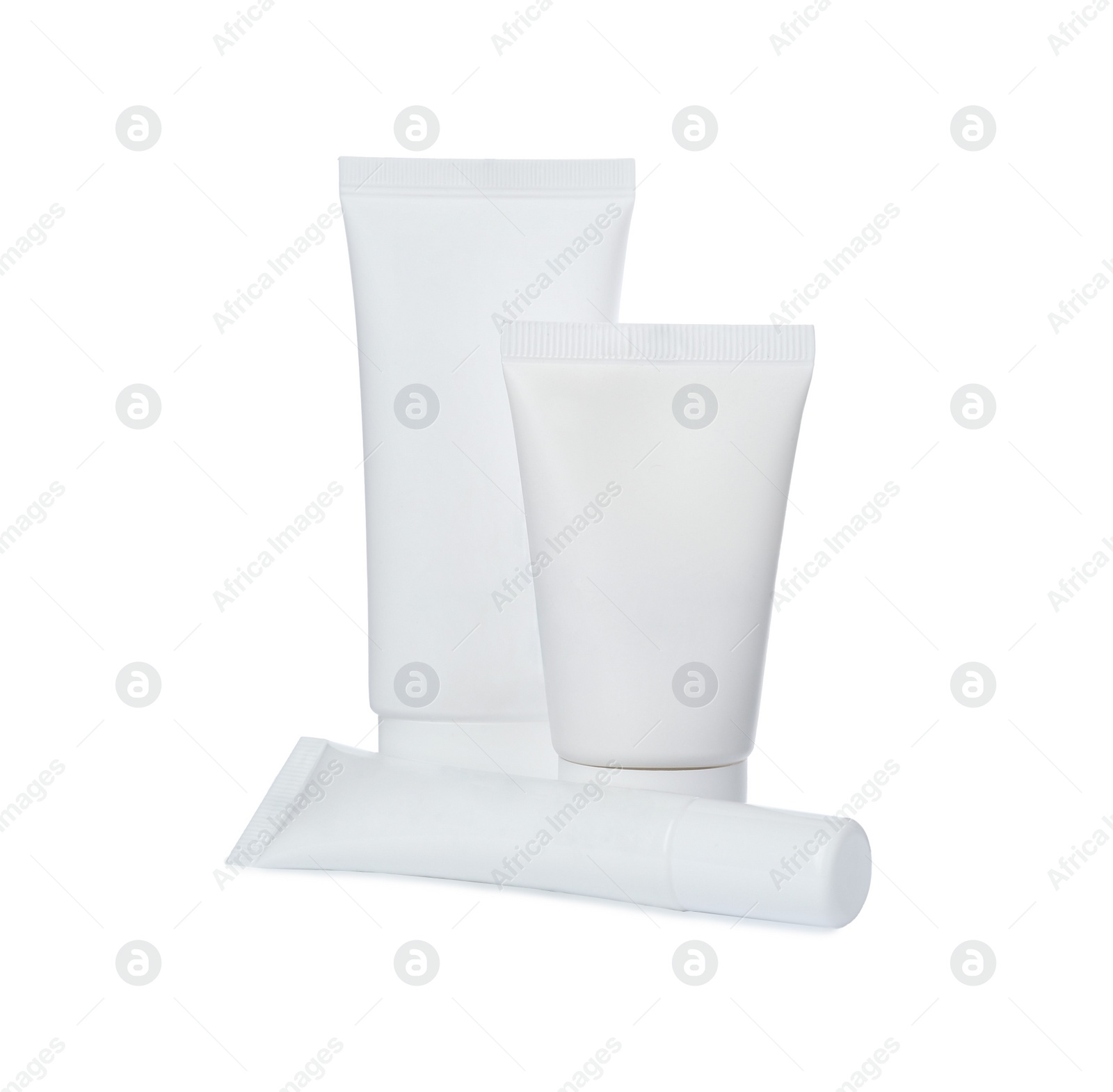 Photo of Tubes of different hand creams on white background. Mockup for design