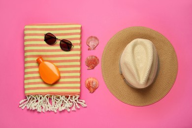 Photo of Flat lay composition with different beach objects on pink background