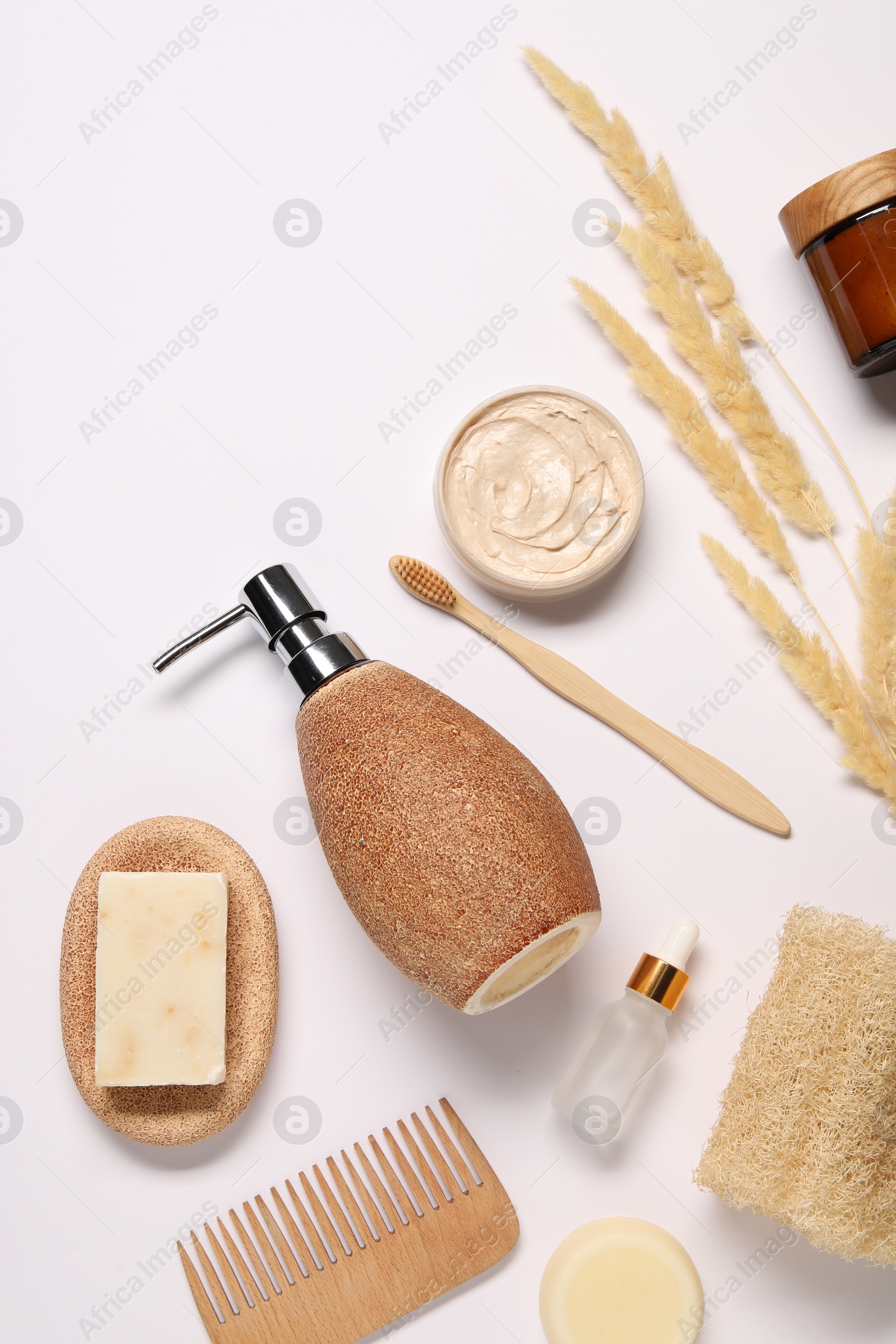 Photo of Bath accessories. Different personal care products and dry spikelets on white background, flat lay