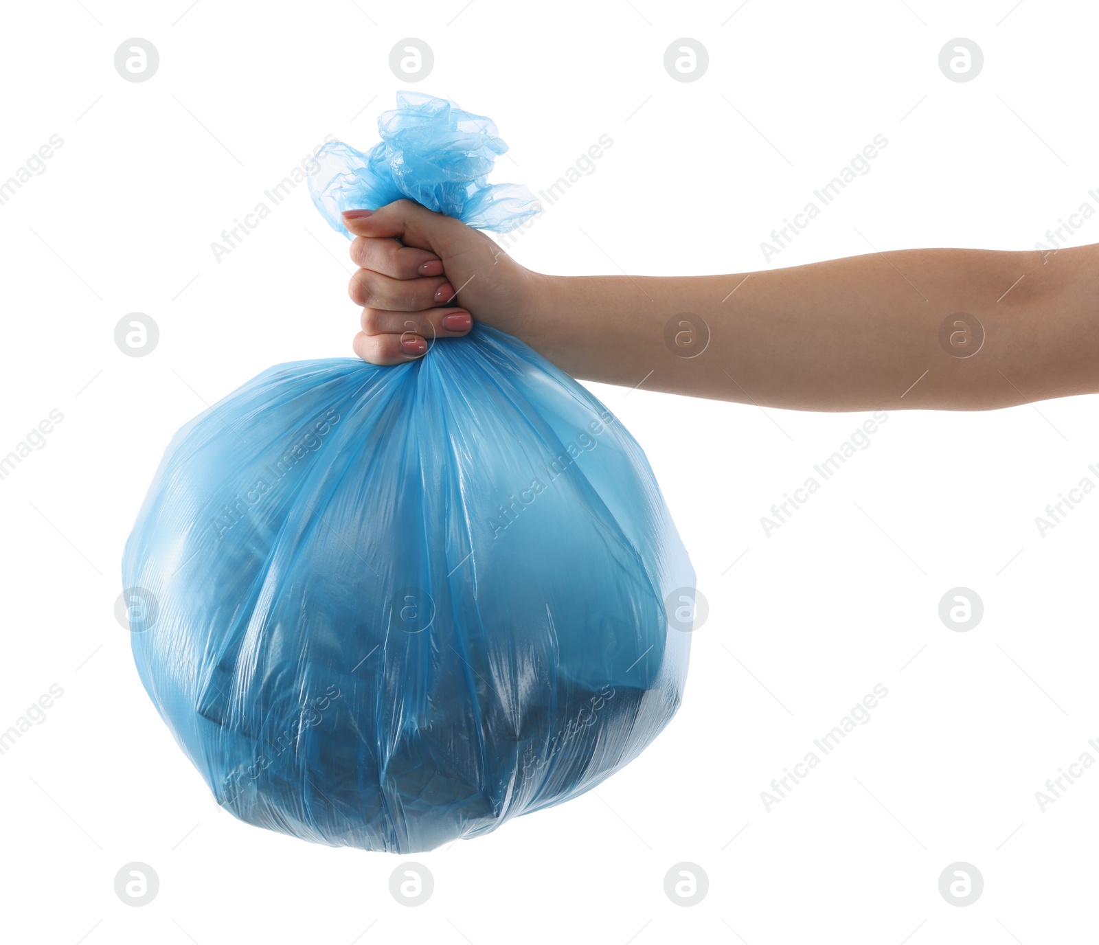 Photo of Woman holding plastic bag full of garbage on white background, closeup