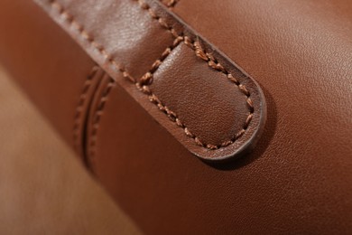 Photo of Texture of brown leather as background, closeup