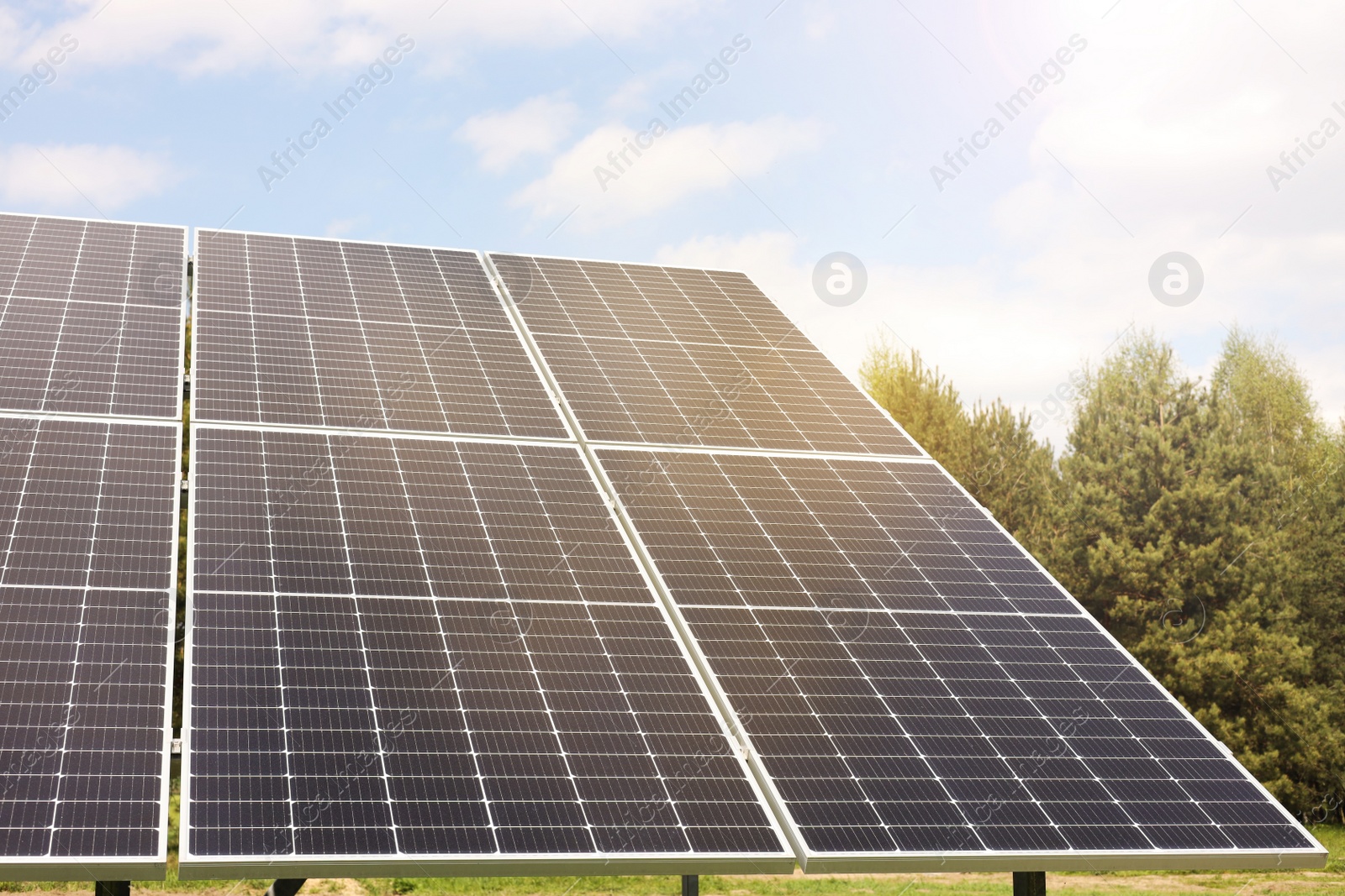 Photo of Solar panels outdoors on sunny day. Alternative energy