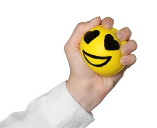 Photo of Woman squeezing antistress ball with funny face on white background, closeup