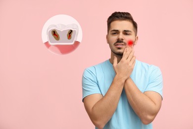 Image of Young man suffering from toothache on pink background