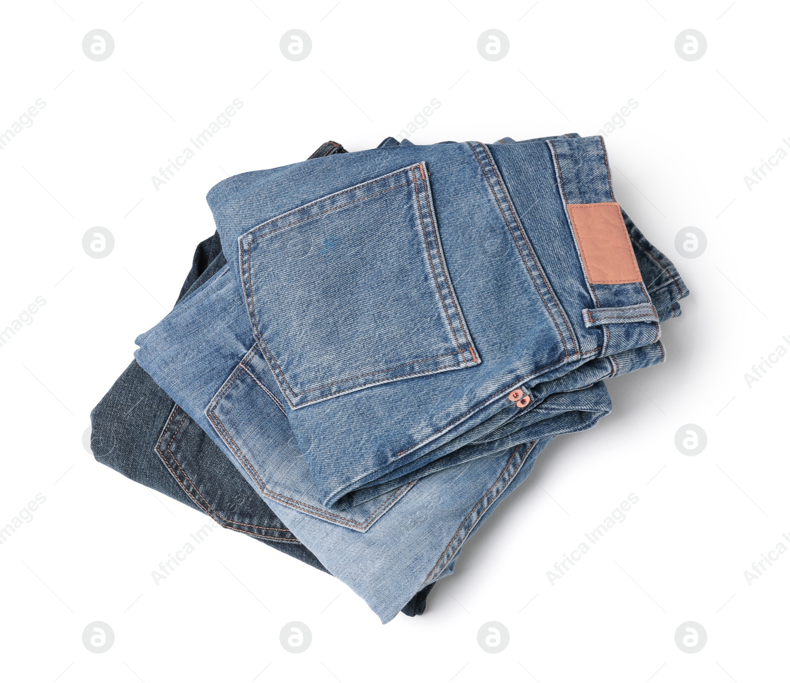 Image of Stack of different folded jeans isolated on white