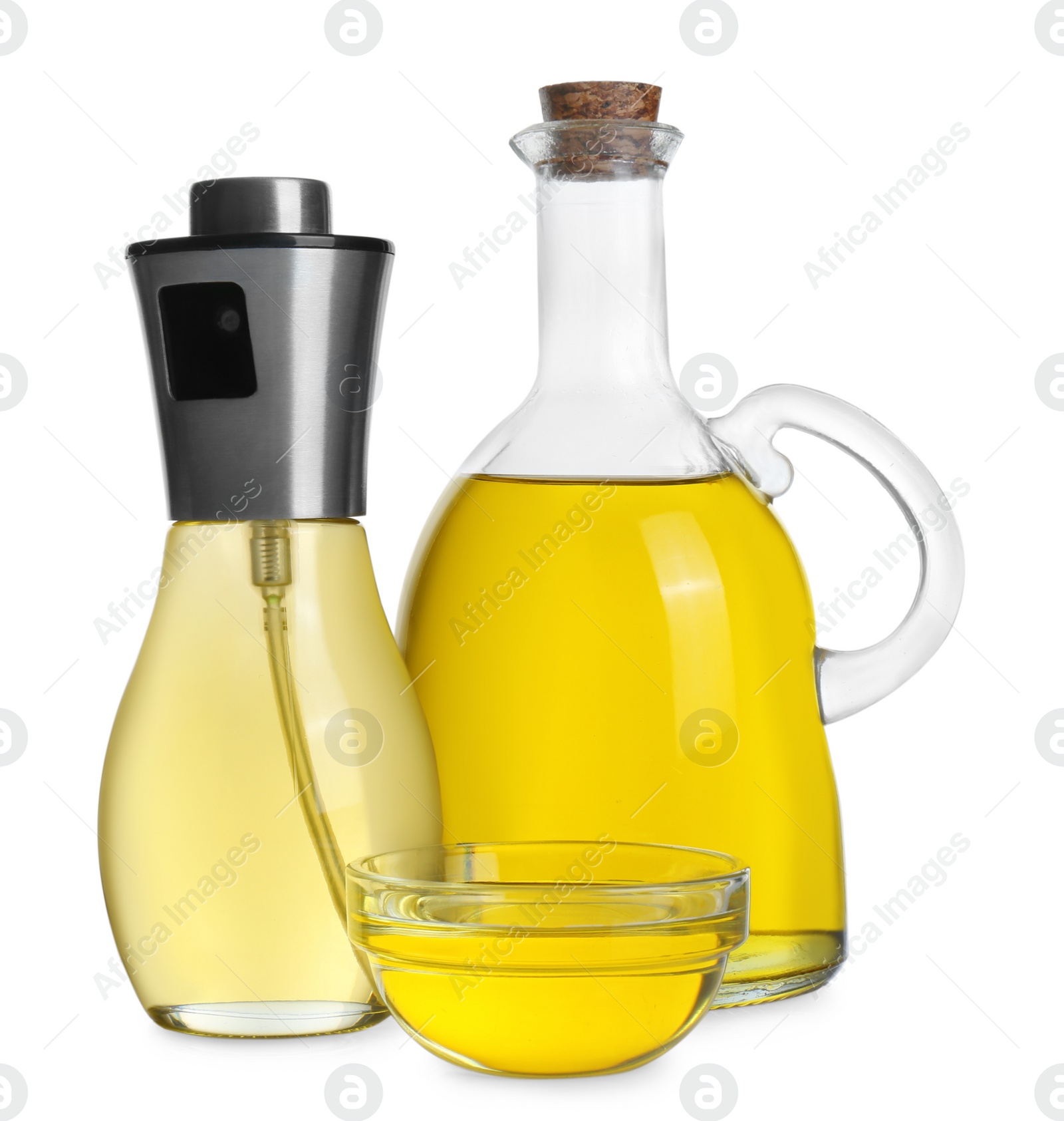 Photo of Bottles and bowl of cooking oil on white background