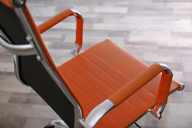 Modern comfortable office chair in room, closeup