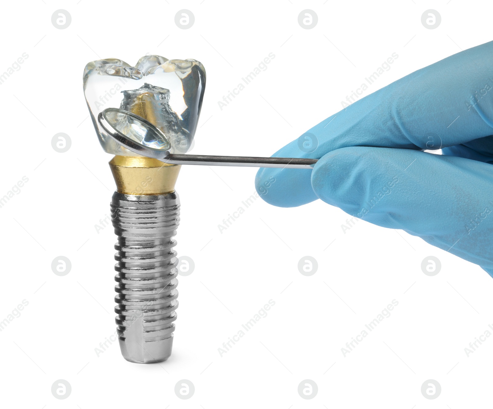 Photo of Dentist with mirror pointing at educational model of dental implant on white background, closeup