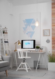 Photo of Comfortable workplace with modern computer on desk. Home office