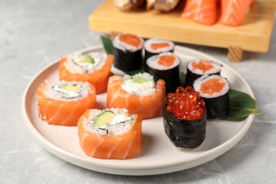 Delicious sushi rolls on white background, closeup