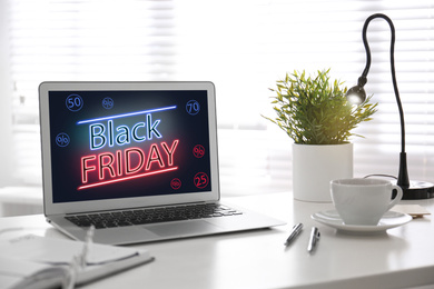Image of Black Friday announcement on laptop screen. Online shopping