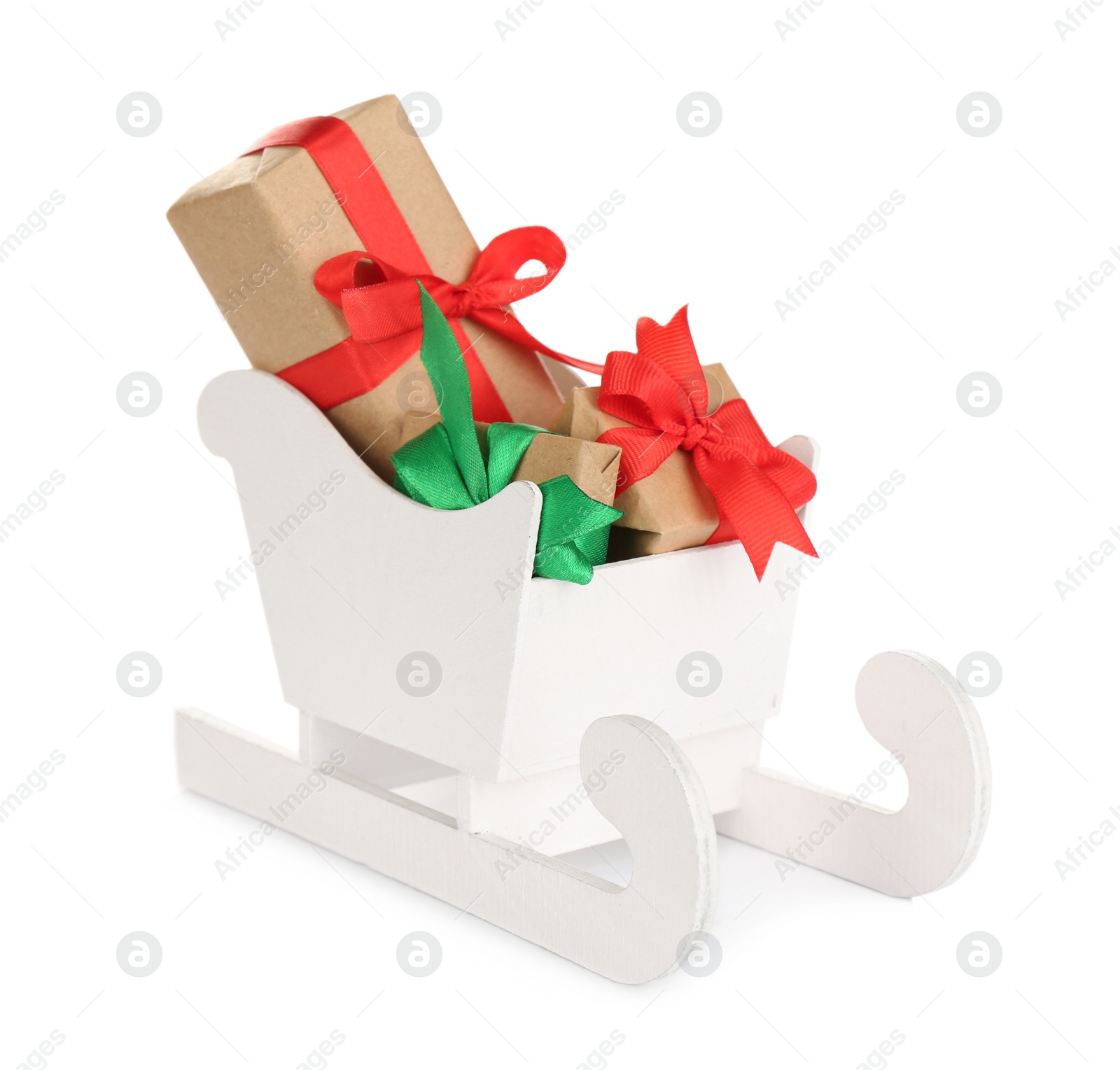 Photo of Wooden sleigh with presents on white background. Christmas holiday decor