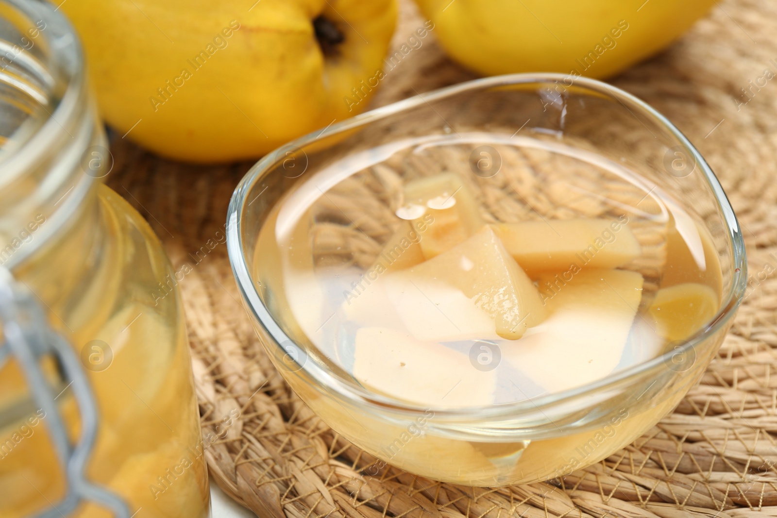 Photo of Delicious quince drink and fresh fruits on table, closeup