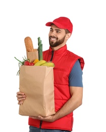 Photo of Man holding paper bag with fresh products on white background. Food delivery service