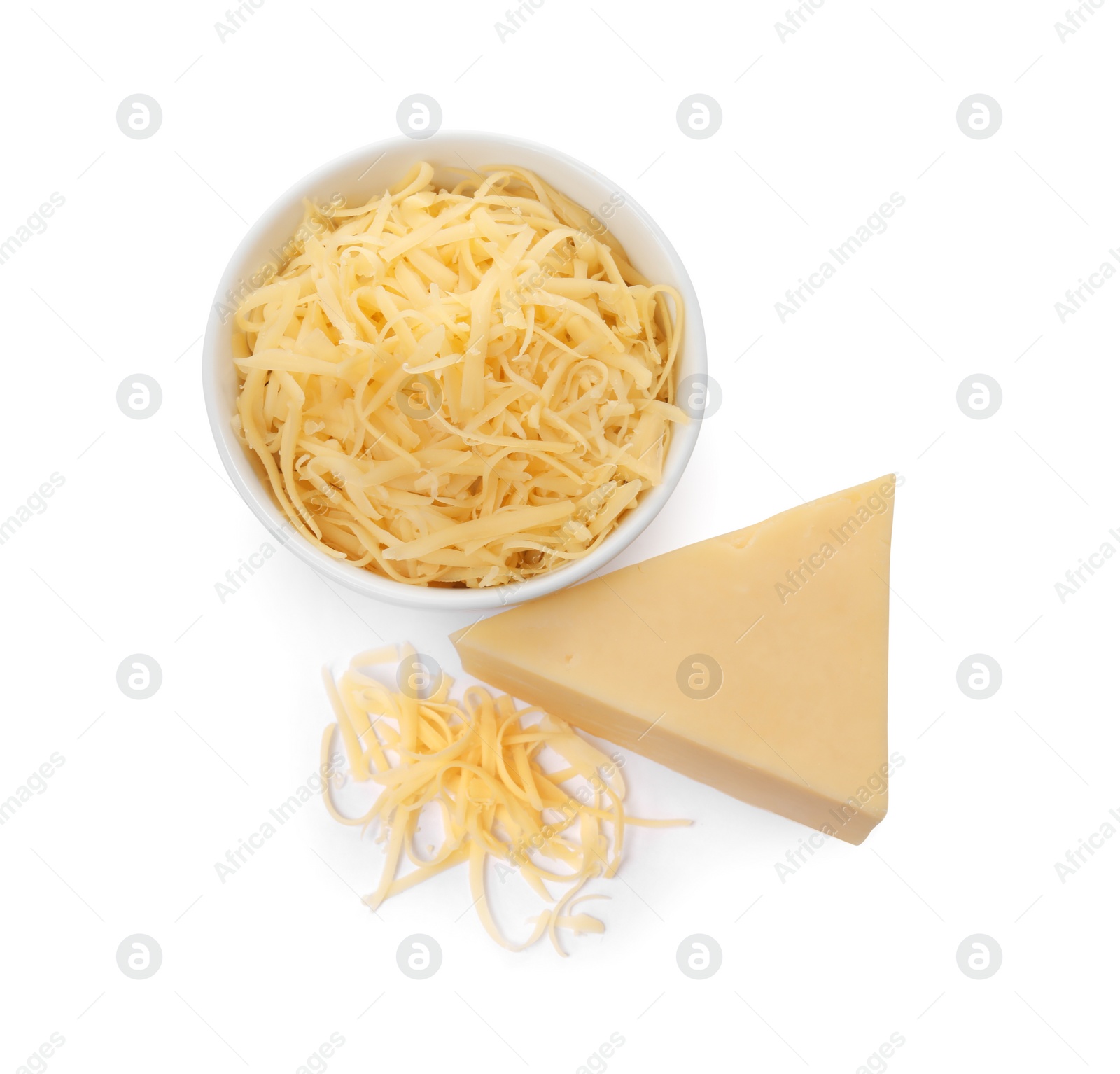 Photo of Grated and whole piece of cheese isolated on white, above view