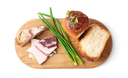 Photo of Board with delicious pampushky (buns), salo and green onions isolated on white, top view
