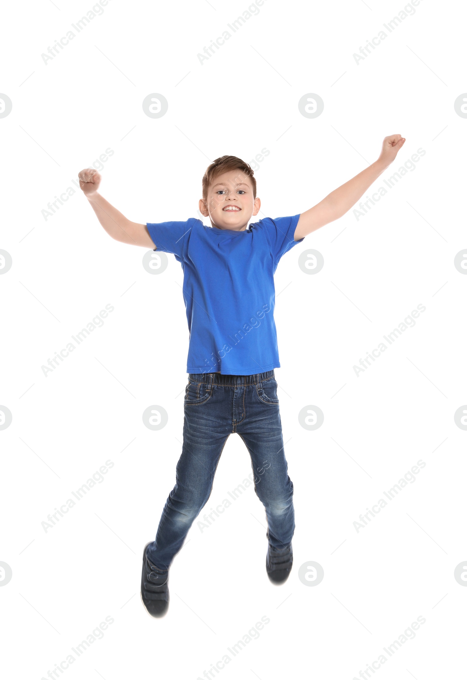 Photo of Portrait of boy jumping on white background
