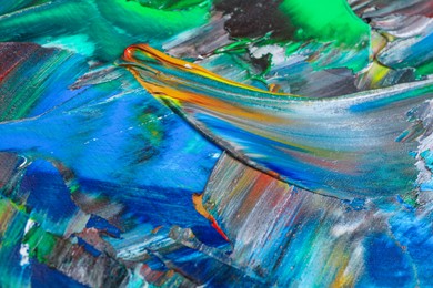 Photo of Abstract colorful acrylic paint as background, closeup view