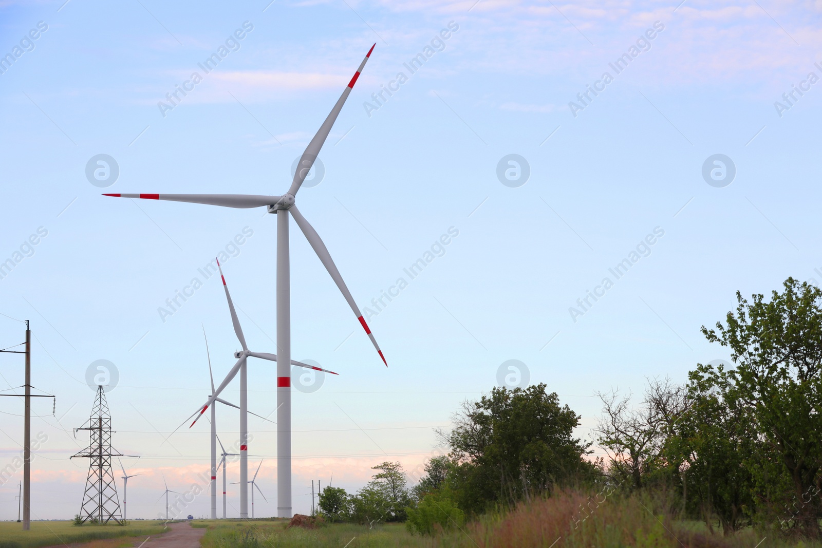 Photo of Beautiful view of landscape with wind turbines in evening. Alternative energy source