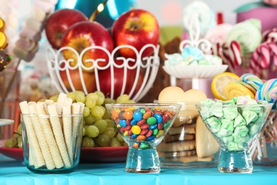 Photo of Candy bar with delicious treats for birthday party