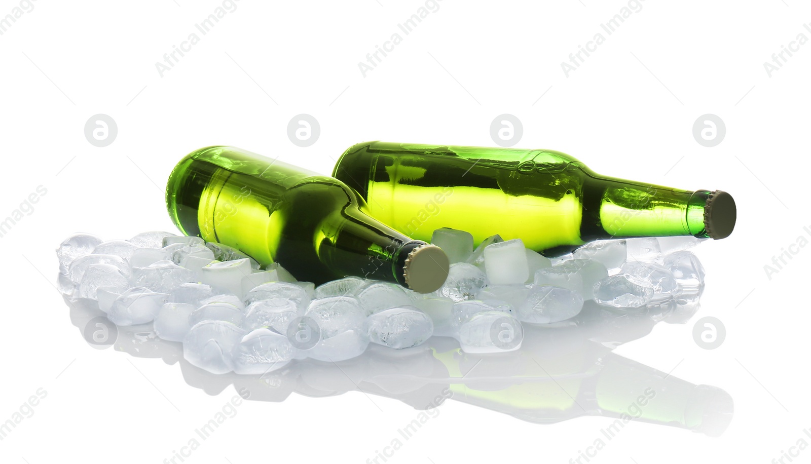 Photo of Bottles of beer and ice cubes on white background