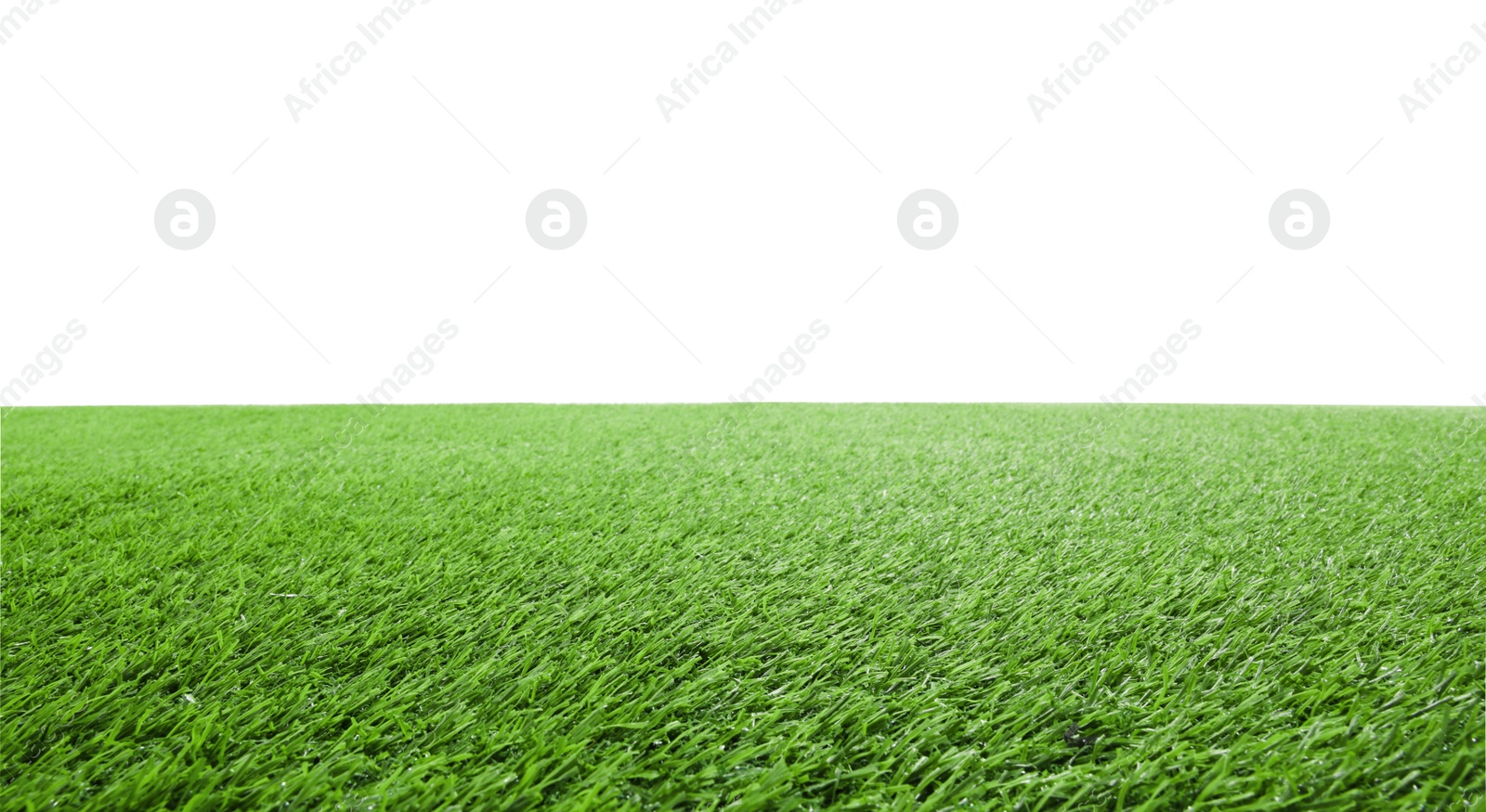 Photo of Green artificial grass surface isolated on white