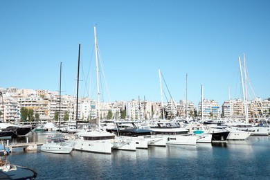 Photo of Picturesque view of port with modern boats on sunny day