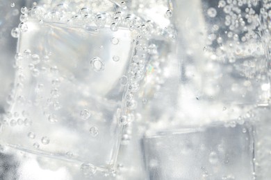 Photo of Soda water with ice as background, closeup