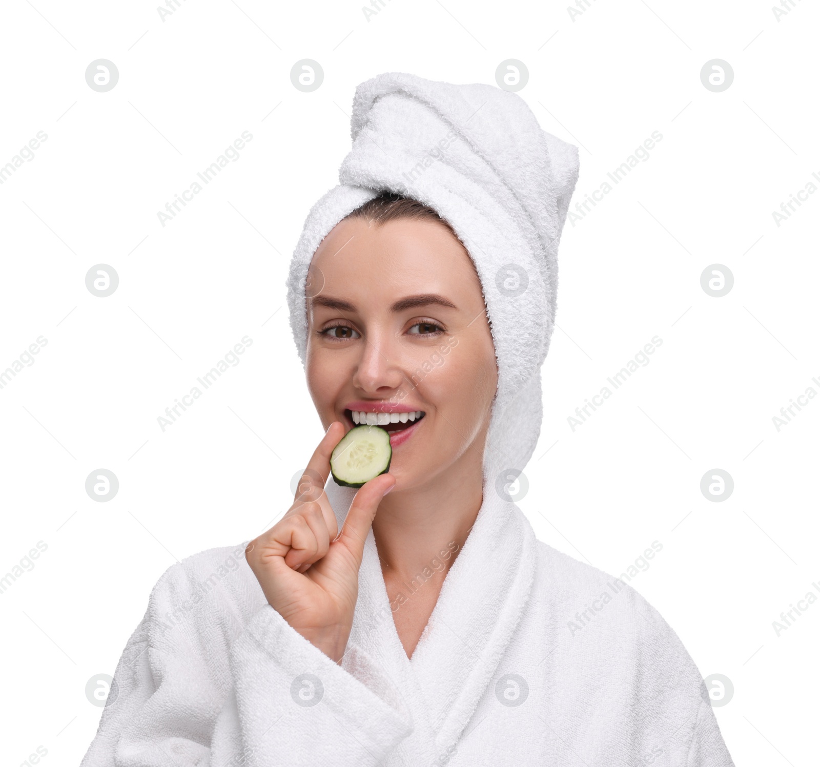 Photo of Beautiful woman in bathrobe with piece of cucumber on white background