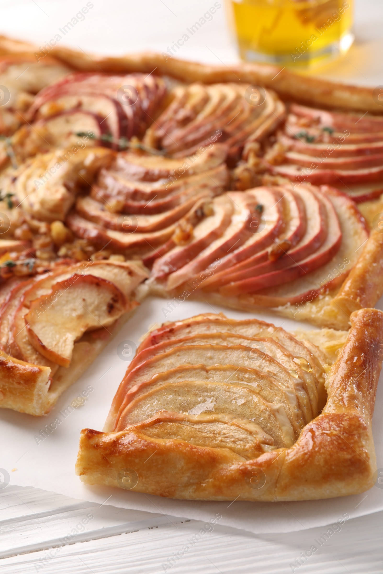 Photo of Freshly baked apple pie on white wooden table, closeup