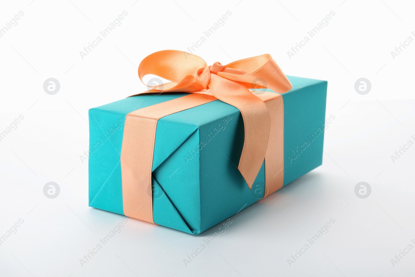 Photo of Beautiful gift box with ribbon on white background