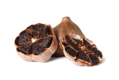 Aged black garlic on white background. Asian cuisine