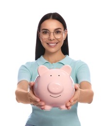 Photo of Happy young woman with piggy bank on white background