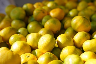 Heap of fresh ripe tangerines, closeup view