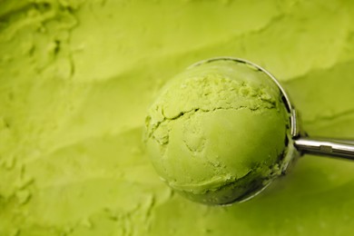Photo of Taking scoop of tasty matcha ice cream, closeup. Space for text